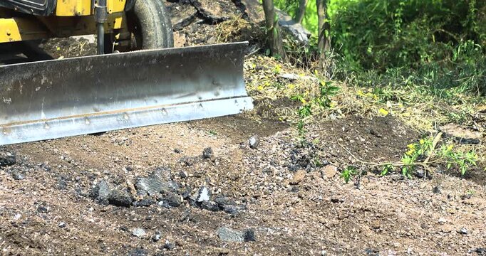 Bulldozer, Loader pushing soil and gravel at a construction site, heavy machinery and infrastructure work outdoors, close-up