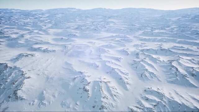 4K aerial view of a vast snow covered landscape with soft winter atmosphere.