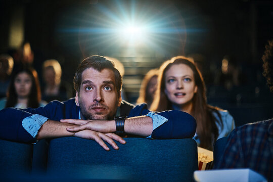 Couple watching a movie in a theater