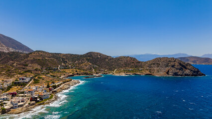 Fototapeta premium Aerial drone view of Mochlos village and turquoise bay on the island of Crete