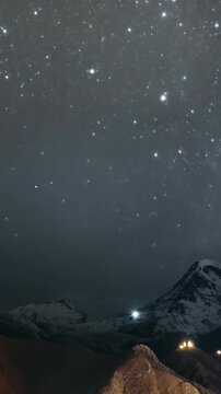 Stepantsminda, Georgia. Georgian Landscape In Winter Season. Hyperlapse Night Bright