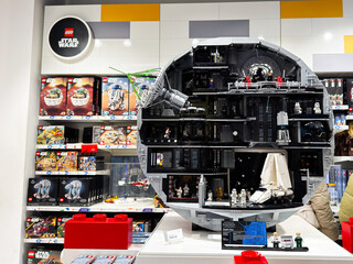 Fototapeta premium Lego Star Wars Death Star model display in a London UK toy store showcasing detailed minifigures, spacecraft and boxed sets in a large cutaway collectible exhibit
