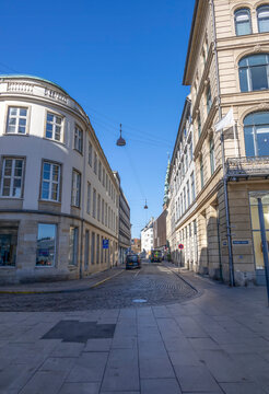 Street scene at Vingardstraede and Laksegade in Copenhagen, Denmark, showcasing historic architecture under clear skies.