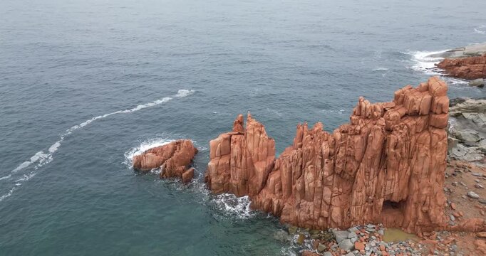 Rocce Rosse red porphyry rock formations in Arbatax, Sardinia, Italy