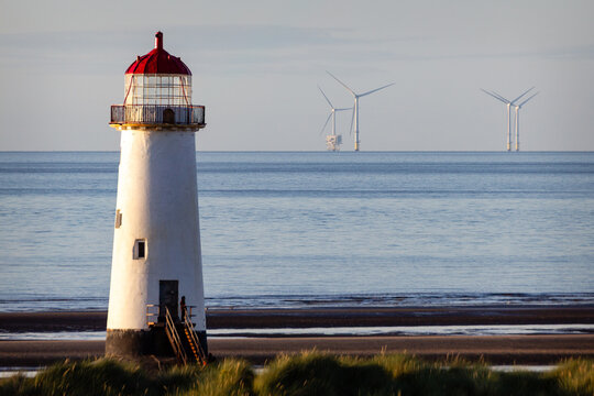 Point of Ayr Lighthouse on Talacre Beach with offshore wind turbines