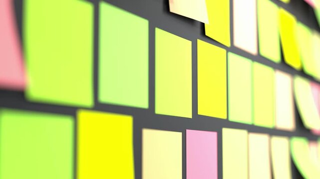 Colorful sticker notes on black wall feature blank adhesive papers in lime green, yellow, pink, and cream tones. The notes flutter with curled corners catching airflow. Useful for project management
