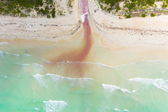 Aerial view of river exiting Las Coloradas lagoon into the sea, Yucatan, Mexico.