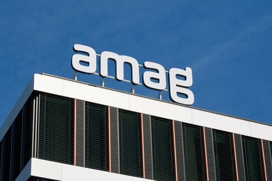 Amag group sign hanging at headquarters building in Cham, Switzerland