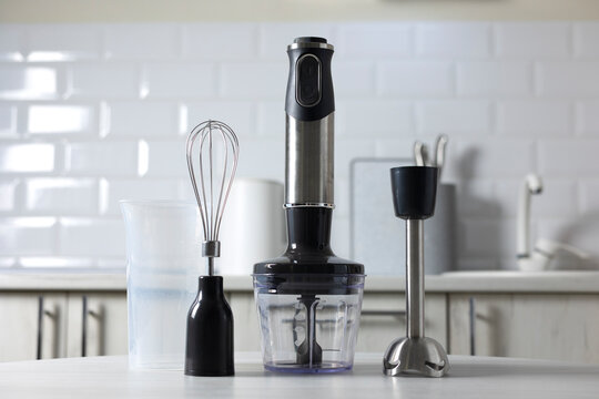 Hand blender on a light kitchen background