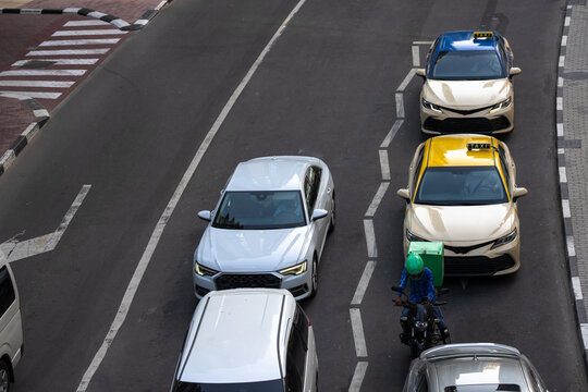 Heavy urban traffic congestion during weekday rush hours, with long queues of vehicles, illustrating commuting delays, city infrastructure pressure, and daily transportation challenges.