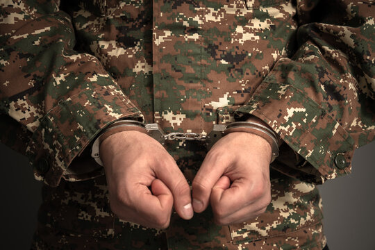 Military-related criminal investigation with detained soldier under arrest, law enforcement action, disciplinary enforcement, justice system process, and security incident concept.