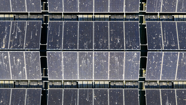 Aerial view of solar panels covered in bird droppings at a floating solar farm in Zwolle, Overijssel, Netherlands.