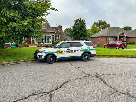 A Montgomery County, TN, Sheriff&rsquo;s SUV parked on the street by a house.