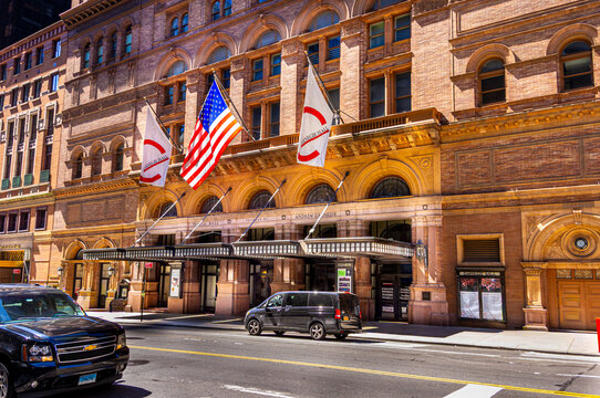 New York City, NY&mdash;June 16, 2018; American and Carnegie Hall flags hang above the historic Carnegie Hall concert venue in Midtown Manhattan.