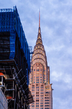 New York City, NY&mdash;June 16, 2018; The illuminated Chrysler Building rises above construction scaffolding at dusk in Midtown Manhattan.