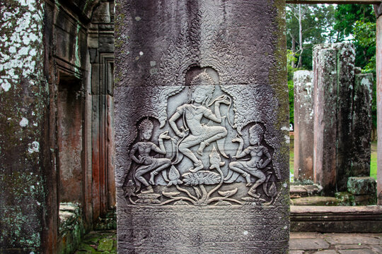Apsara dancers bas-relief on a pillar at Bayon Temple, Cambodia.