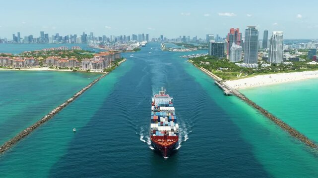 Miami, Florida, USA - May 16, 2025: Cargo ship loaded with container in Miami, aerial. Freight container, copy space. Aerial Miami port with cargo container. Export and import. Port of Miami