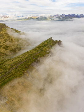 Aerial view of misty mountains surround ing the bay of Unalaska, Alaska, USA.
