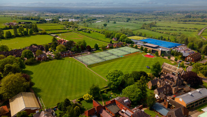 High aerial view of elite school sports campus and athletic fields © Андрей Нелупов