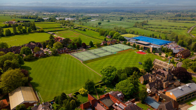 High aerial view of elite school sports campus and athletic fields