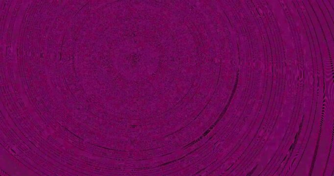 Abstract concentric circle patterns alternating between vibrant green and deep purple colors.