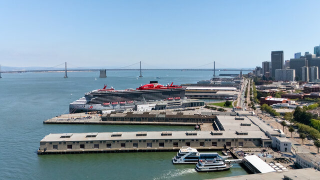 San Francisco waterfront with piers cruise terminal and Bay Bridge aerial view Editorial use only