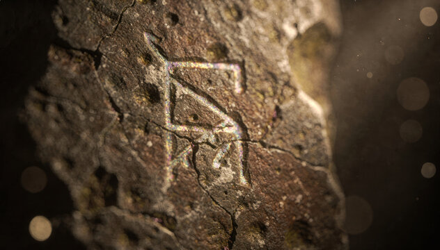 Ancient runic symbol carved into rough textured stone surface under light