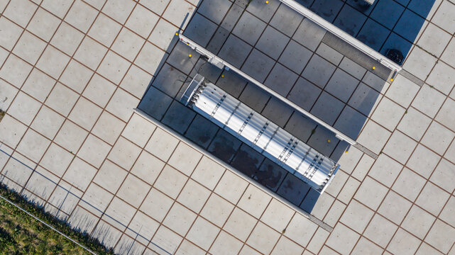Aerial view of industrial storage tanks and infrastructure at Erflanden featuring a geometric paved ground pattern Hoogeveen, Drenthe, Netherlands.