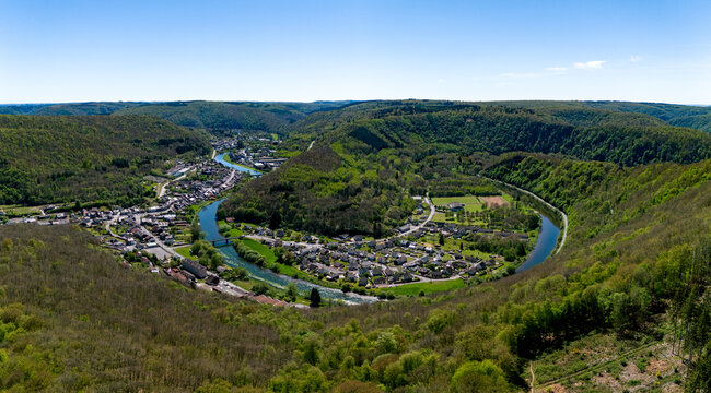 Aerial view of the Ardennes landscape featuring the Semoy river meander and the village of Les Hautes-Rivieres surrounded by lush green forests Les Hautes-Rivieres, Grand Est, France.