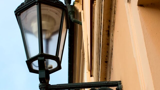 The lantern hanging on the wall in the city of Prague