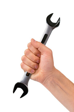 Isolated hand of a man gripping a large shiny chrome metal wrench for maintenance work