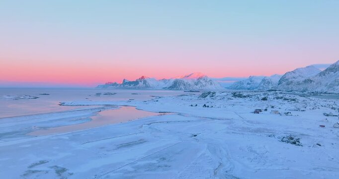 Aerial view of the Lofoten peaks during sunrise in winter