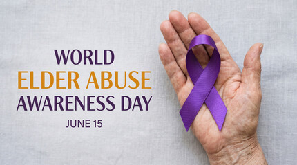 World elder abuse awareness day concept with a purple ribbon held in an elderly persons hand
