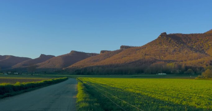 View of Sant Miquel de Castell&oacute; i Falgars early in the morning in spring, Vall d'en Bas, Girona, Spain