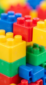 Colorful plastic building blocks closeup.