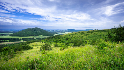 The crater and its surroundings were filled with the light green of spring and a warm breeze! Unique landscape of Bichimi-Oreum(small extinct volcano) in spring, Jeju Island, South Korea. © Chanwoo Lee