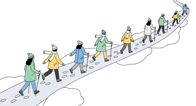 Group of people hiking in winter with walking sticks.