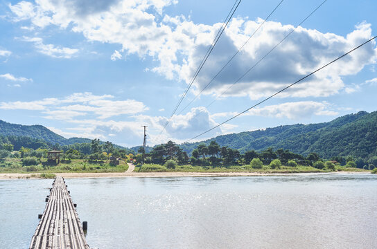This captivating photo series showcases South Korea's Hoeryongpo village. It features a majestic panoramic view of the meandering river from Hoeryongdae and a unique steel bridge crossing the water.