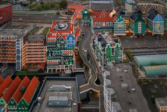 Zaandam, Netherlands - 26 April 2022: Aerial view of the Inntel Hotels Amsterdam Zaandam featuring its unique stacked house architecture and surrounding urban landscape.