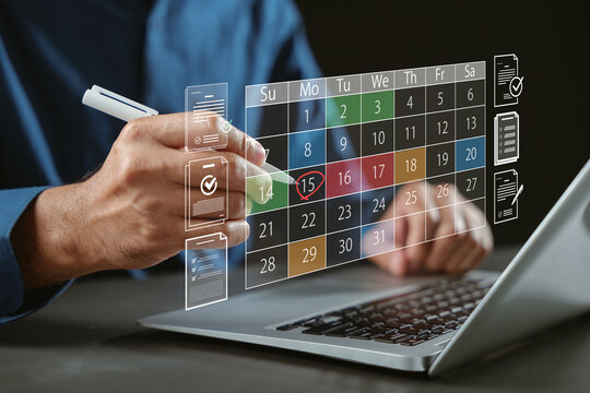 Planning schedule with calendar for time management concept, deadline tracking, digital task list on laptop screen, businessman organizing daily work project, productivity goals reached