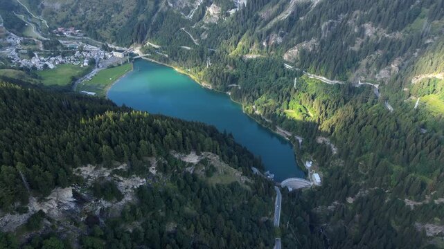Aerial shot of Lago di Isola surrounding Valle Spluga Val San Giacomo in the Italian Alps