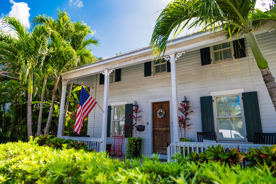 Architectural building. Residential district with house property. Architectural residential district. House architecture. Modern building exterior American flag. Residential building architecture