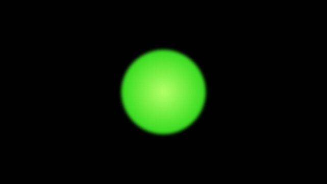 Luminous green orb glowing in the darkness