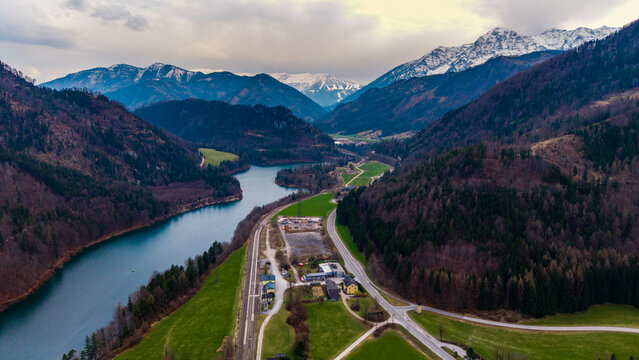 Klaus an der Pyhrnbahn, Austria - 23 March 2026: Aerial view of the VOEST Quarry and Klauser Stausee surrounded by the Pyhrn-Priel mountains and dense forests in the Steyr river valley.
