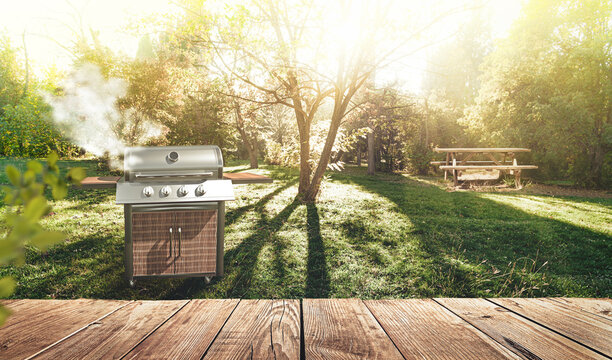 summer time in backyard garden with grill BBQ, wooden table, blurred background