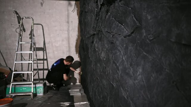 Final Environment Adjustment. Final Inspection And Cleanup Under Professional Studio Lighting Conditions