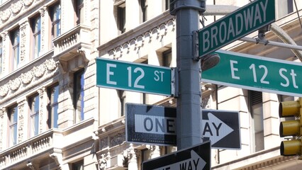 Obraz premium New York City Broadway street sign on Manhattan, United States. Urban road sign in american city. Traffic sign in Midtown of NYC, USA. Building architecture in residential district near Union Square.