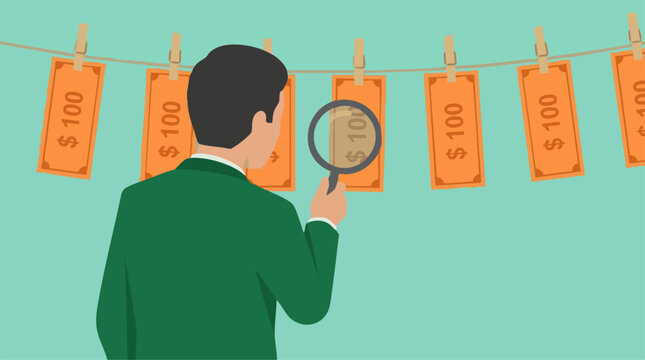 Businessman examining cash on a clothesline with magnifying glass, money laundering