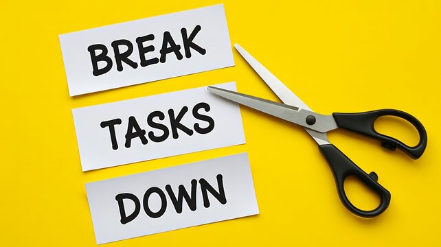 Break tasks down productivity concept with scissors and paper notes