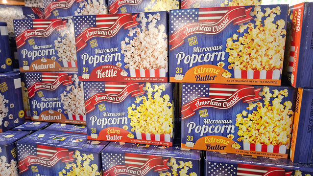 ​Assorted boxes of American Classic microwave popcorn including natural kettle corn and extreme butter flavors stacked on supermarket retail shelf on May 8, 2026 in Bangkok, Thailand.